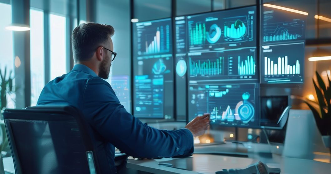 Executivo analisando gráficos financeiros digitais, simbolizando a terceirização financeira como estratégia para otimização de custos e crescimento empresarial.